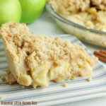 A close up view of a slice of apple pie.