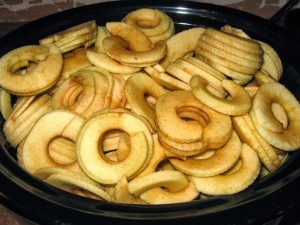 Slow cooker full of sliced apples. 