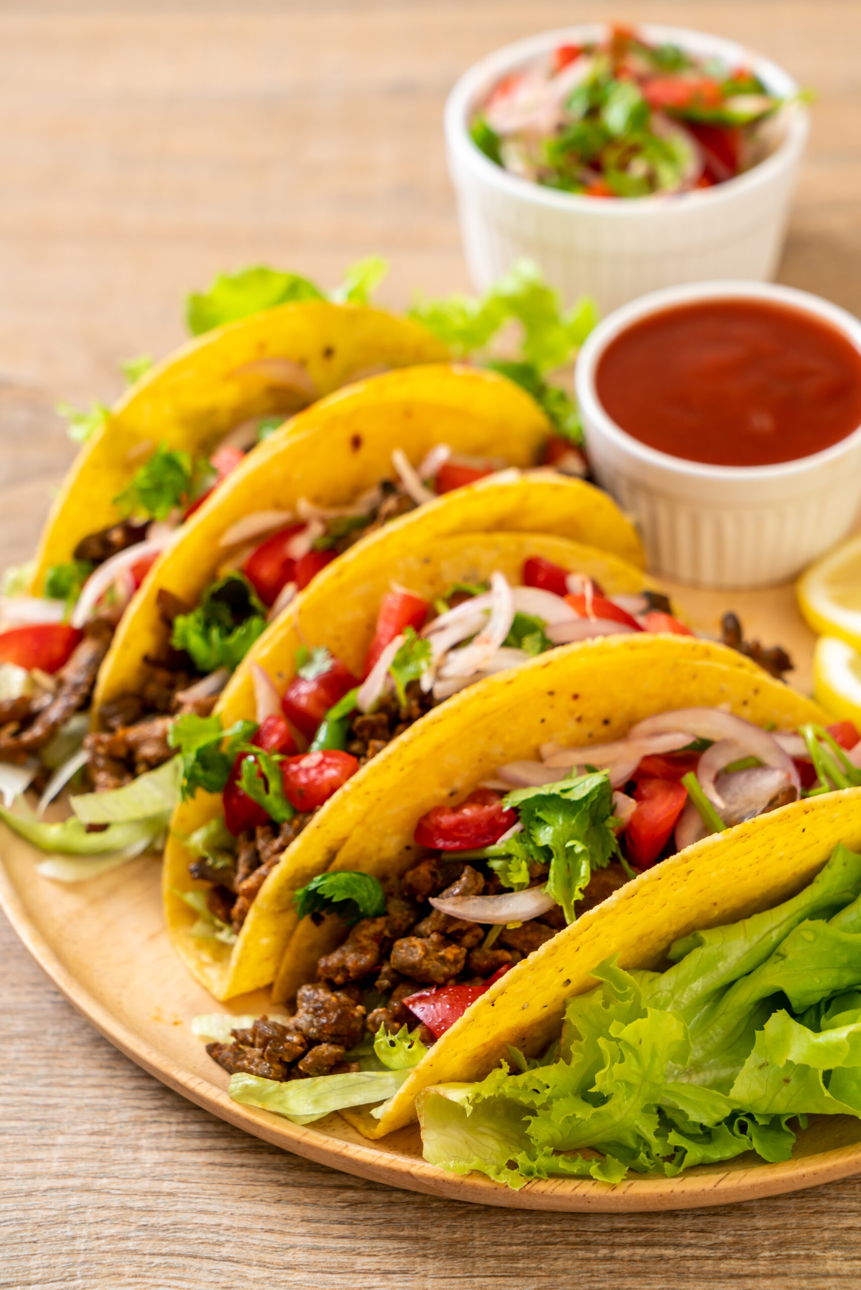 Tacos sitting on a plate.