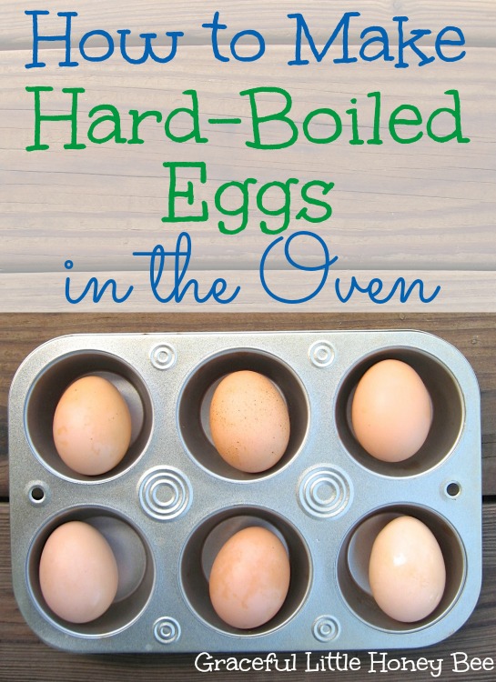 Eggs in a muffin tin sitting on a wooden board.