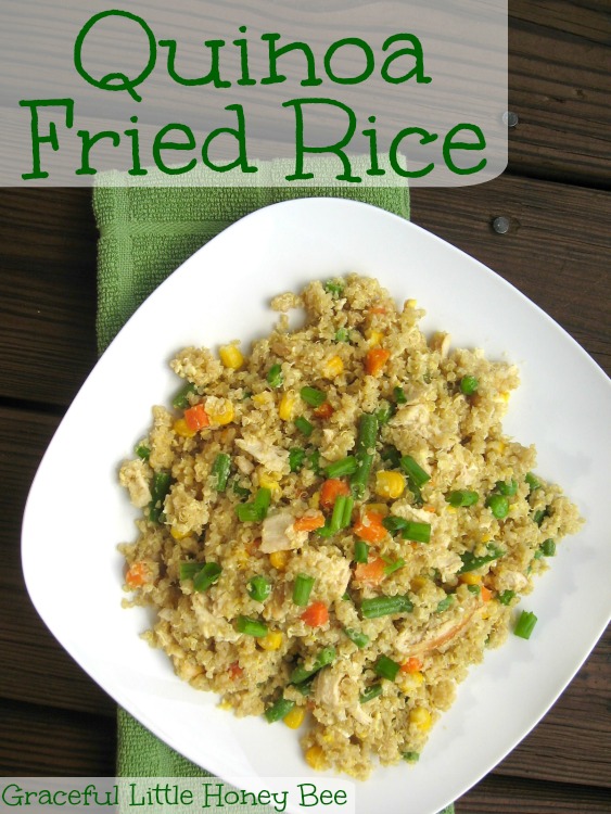 Quinoa Fried Rice on a white plate with a green towel in the background.