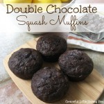 Double Chocolate Squash Muffins on a wooden cutting board.