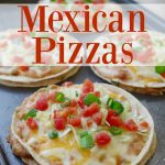 Homemade Mexican pizzas on a black cutting board.