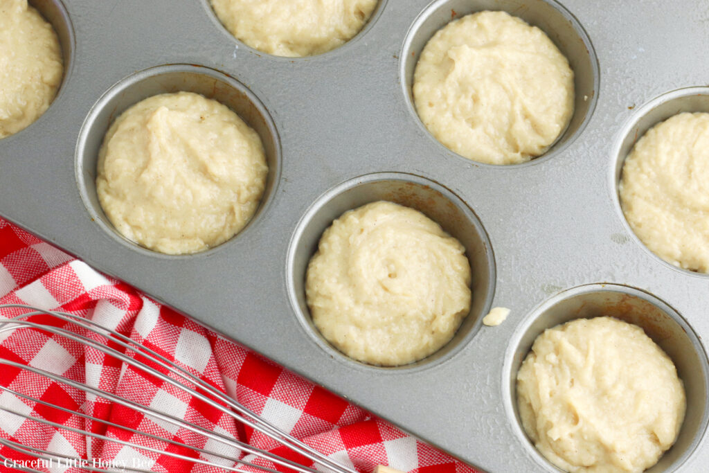 Muffin batter in muffin tin.