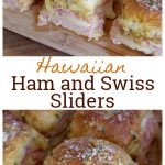 Ham and cheese sliders sitting on a wooden cutting board.