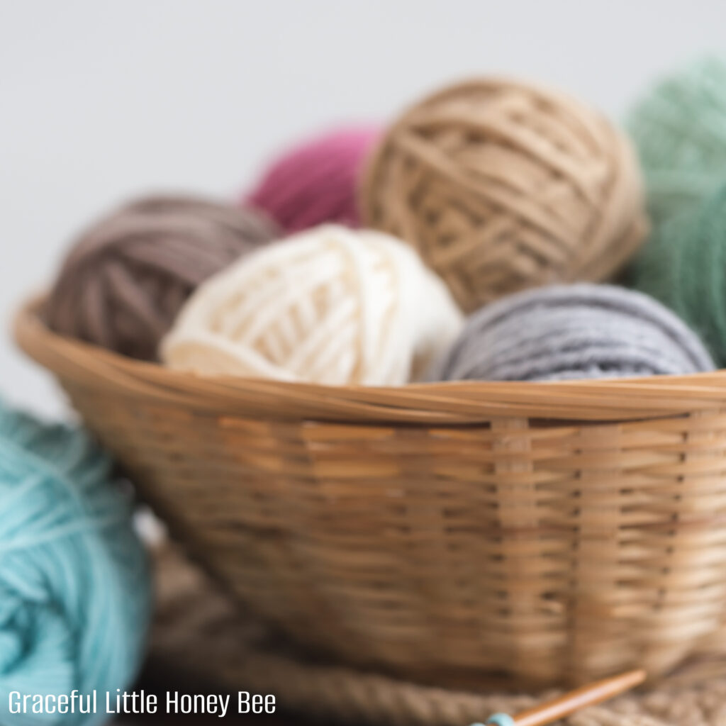 Balls of yarn in a wicker basket.