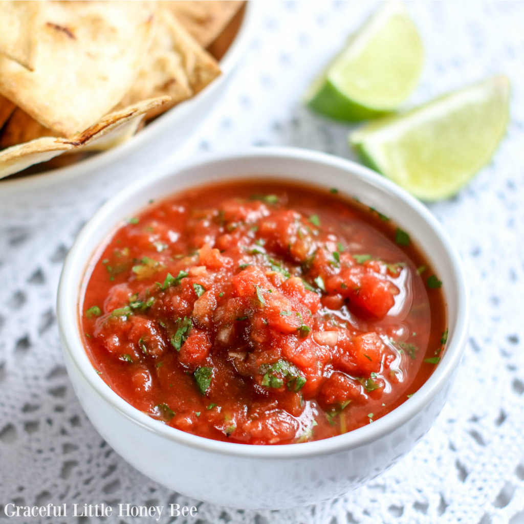 This Blender Salsa made restaurant style is incredibley fresh tasting and comes together in only 5-minutes! Visit gracefullittlehoneybee.com for the recipe.