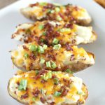 These Cheesy Bacon Ranch Twice Baked Potatoes are a dish that the whole family is sure to love and they also make a filling weeknight meal! FInd the recipe at gracefullittlehoneybee.com