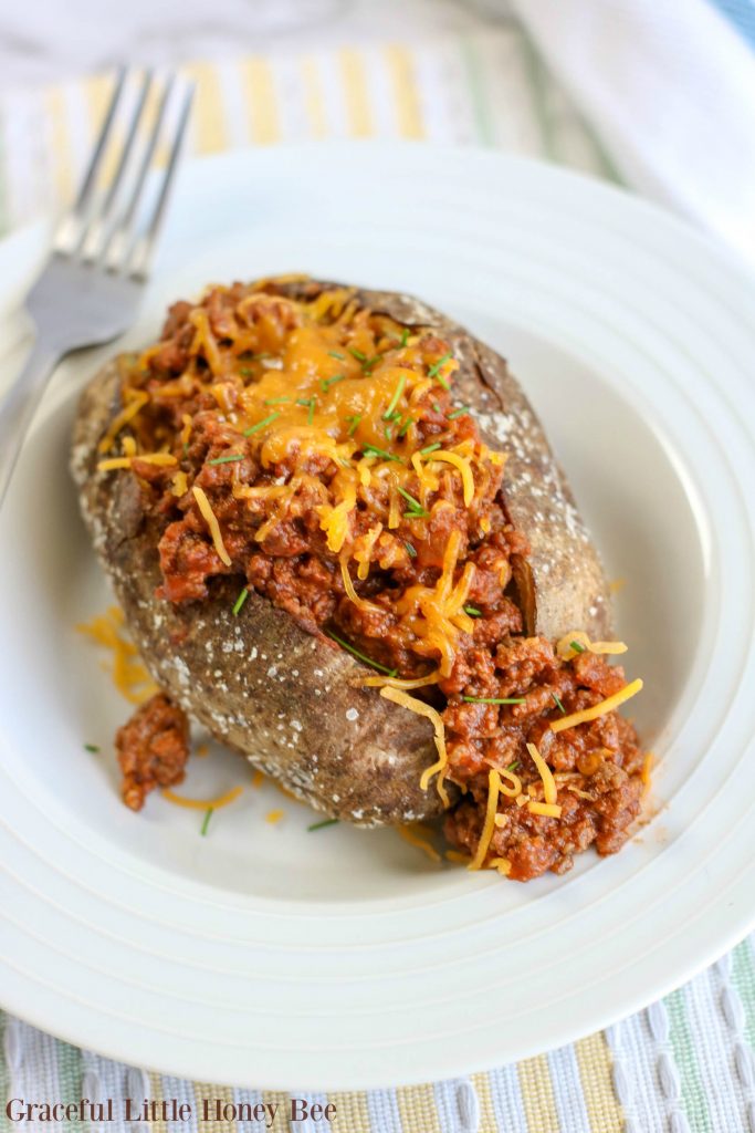 Try this super easy and kid-friendly recipe for Cheesy Sloppy Joe Baked Potatoes that makes a quick weeknight meal!