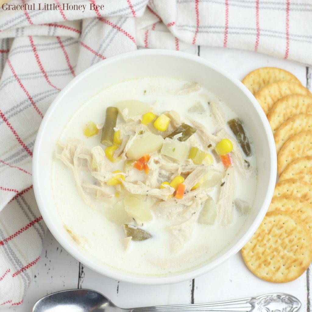 This Slow Cooker Chicken Pot Pie Soup has all of the comforting flavors of the traditional dish that you love without work! Find the recipe at gracefullittlehoneybee.com