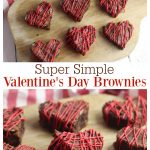 Heart shaped brownies on a wooden cutting board.