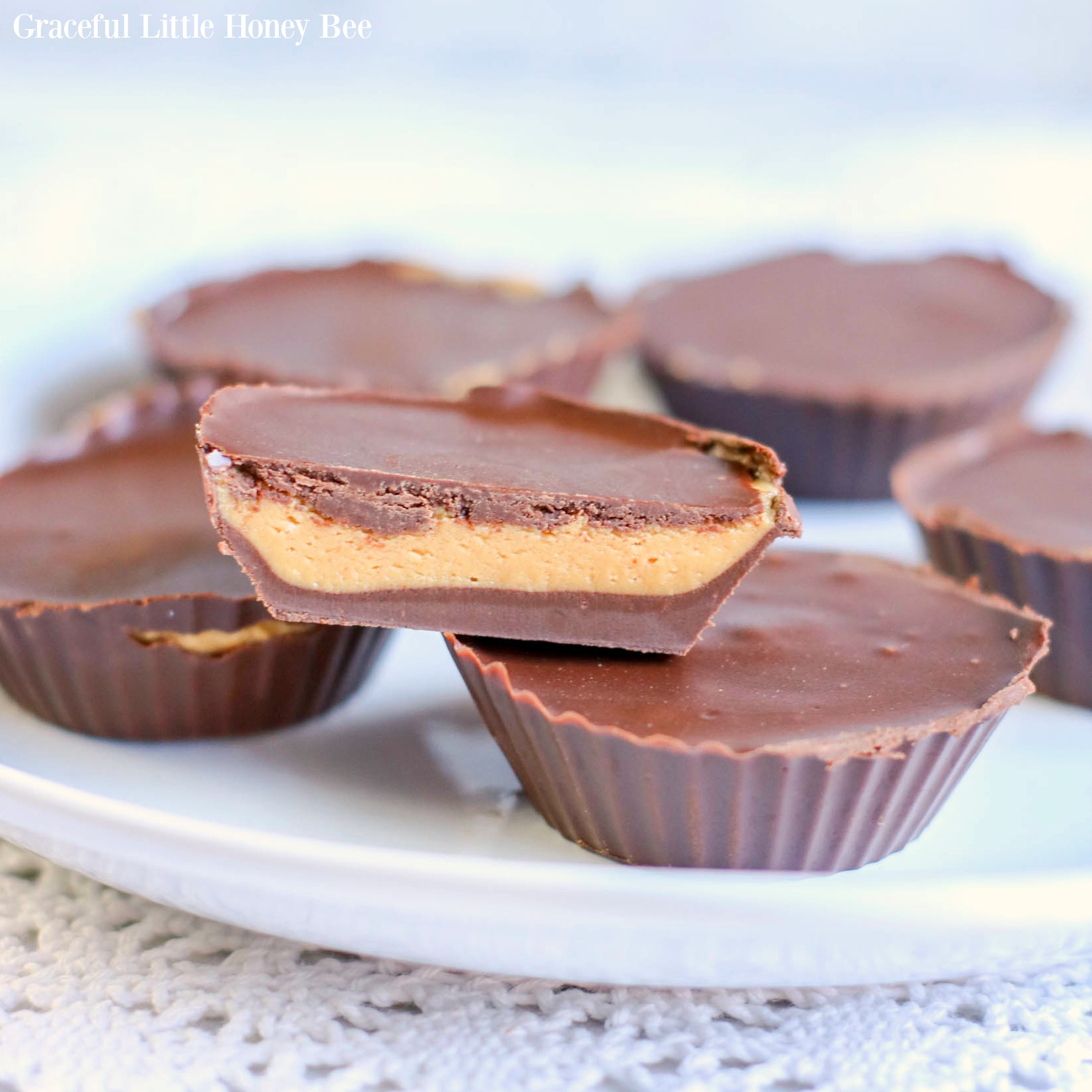 Peanut Butter Chocolate Keto Fat Bombs on a white plate.