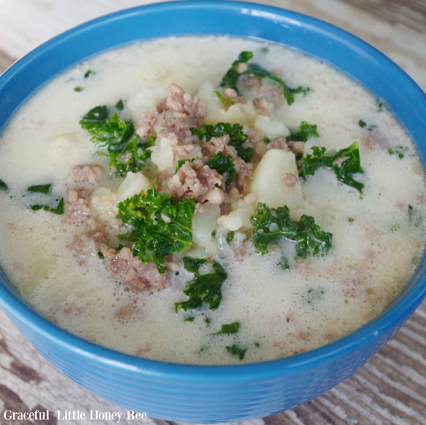 Zuppa Toscana Soup in a blue bowl.