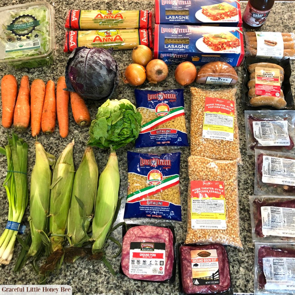 Groceries laid out on a granite counter.