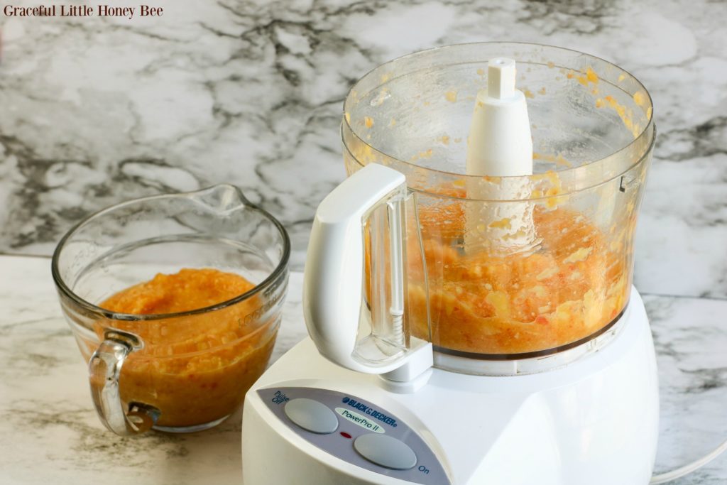 Peaches being process in a food processor.