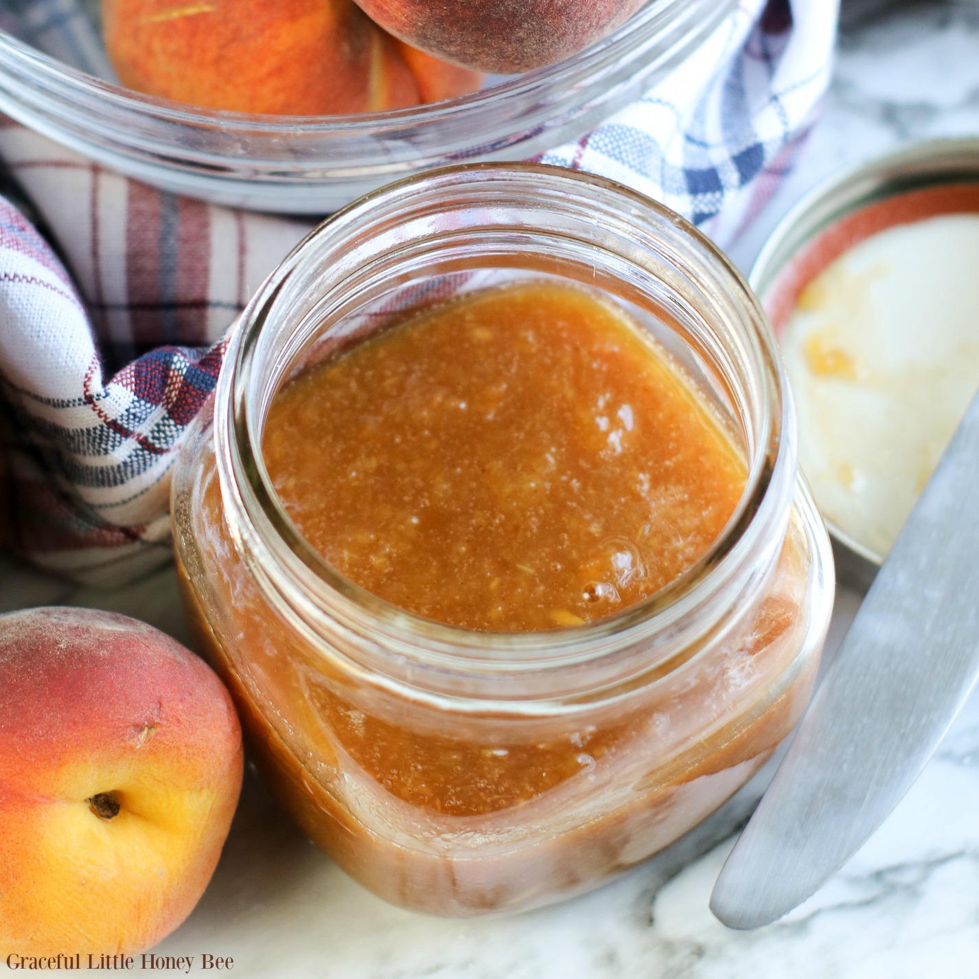 Finished peach butter in a mason jar.