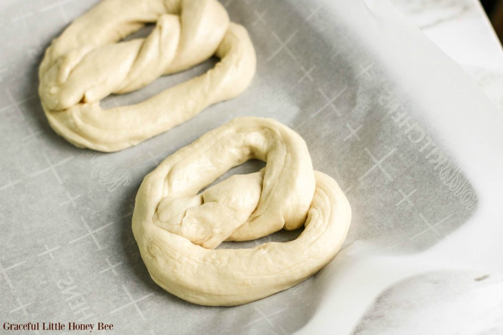 Pretzel dough in pretzel shape.