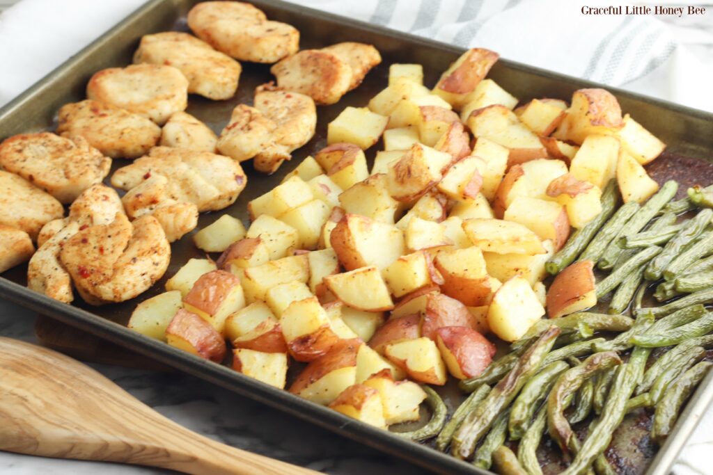 All cooked ingredients lined up on a baking sheet.