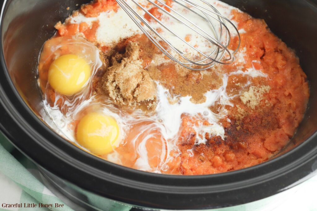 All raw ingredients dumped in slow cooker before mixing.