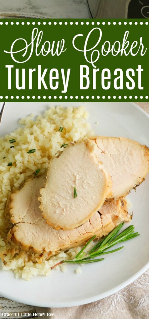 Tender, juicy turkey breast served on a whilte plate over rice garnished with fresh Rosemary.