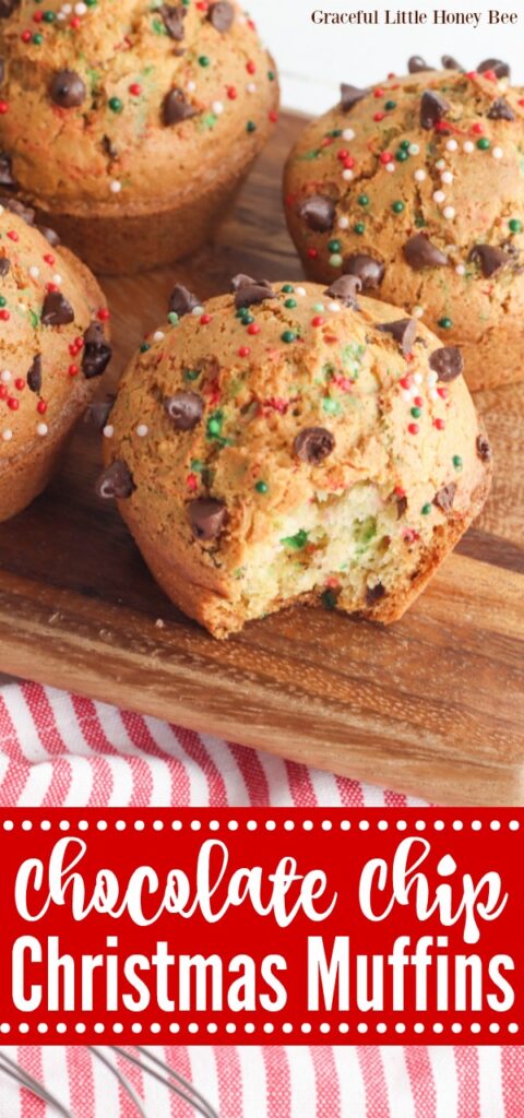 Chocolate Chip Christmas Muffins sitting on a wooden cutting board.