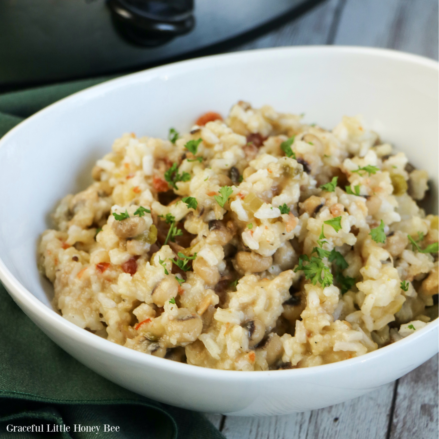 Black-eyed peas and rice in a white bowl.