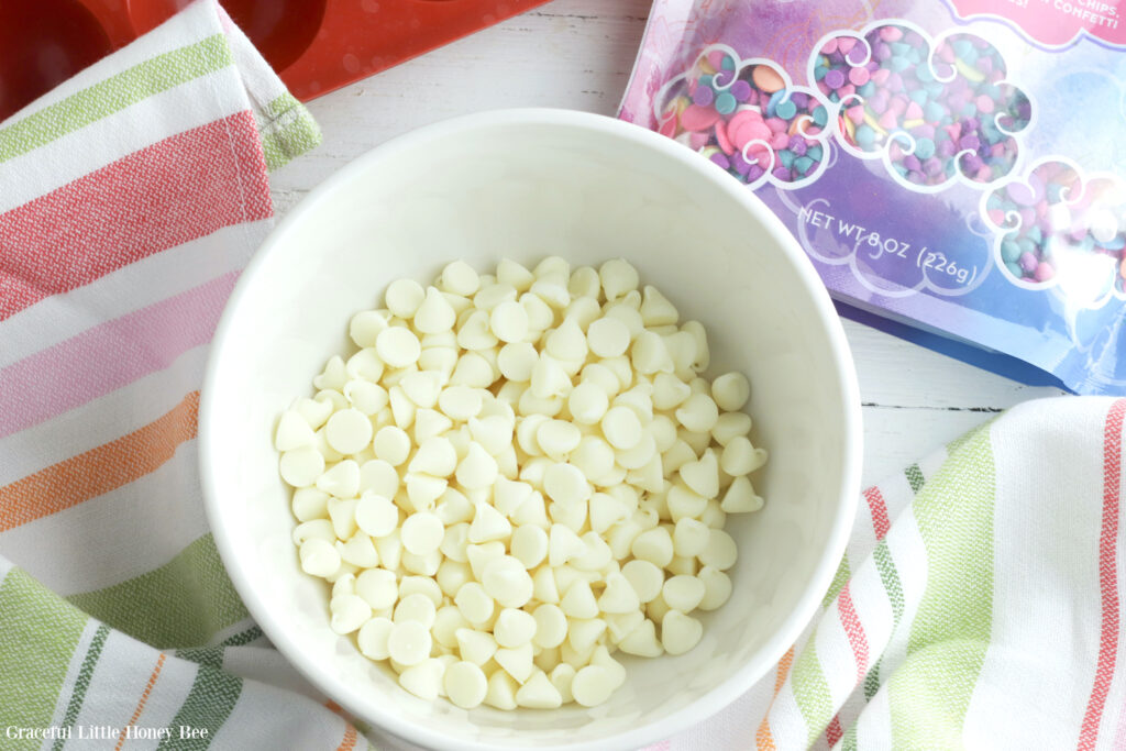 White chocolate chips in a white bowl.