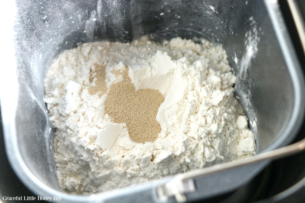 Dry ingredients sitting in bread machine pan.