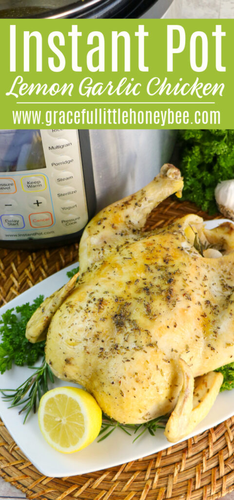 A whole chicken sitting on a white platter ganished with parsley and lemon.