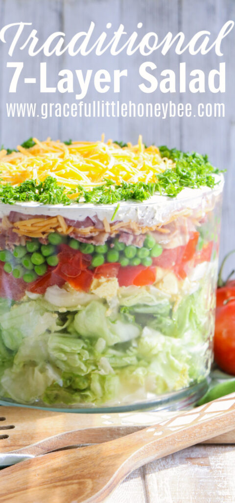 7-Layer Salad in glass trifle bowl.