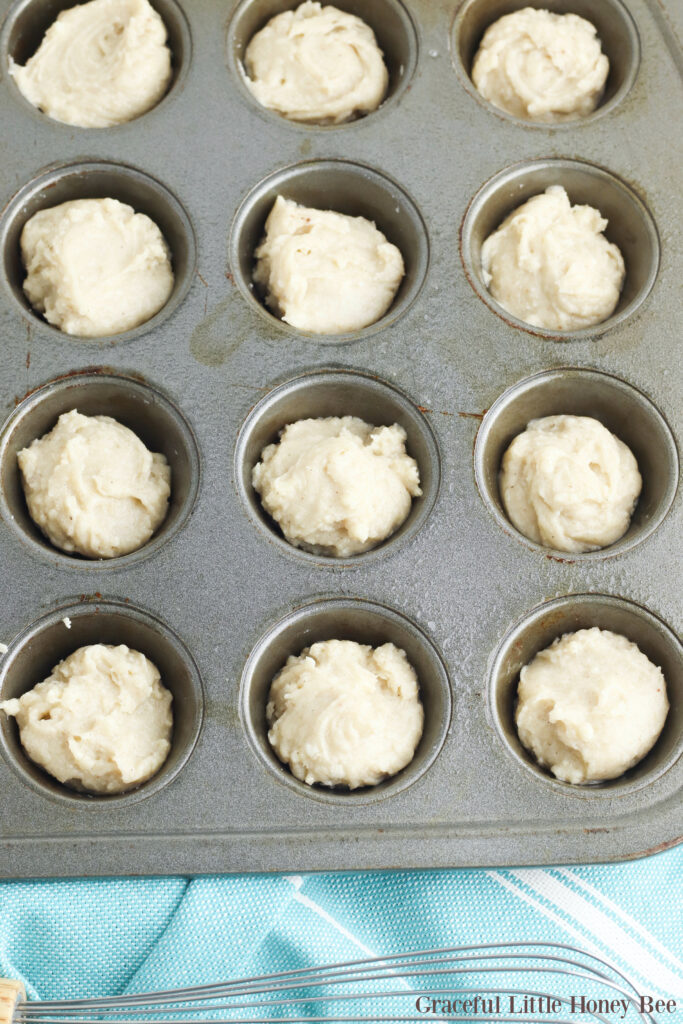 Muffin batter in mini muffin pan.