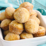 Donut Hole Muffins piled together in a square white bowl.