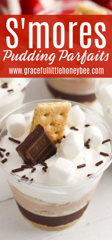 A s'mores pudding parfait topped with mini marshmallows, chocolate sprinkles, graham cracker and Hershy's chocolate.