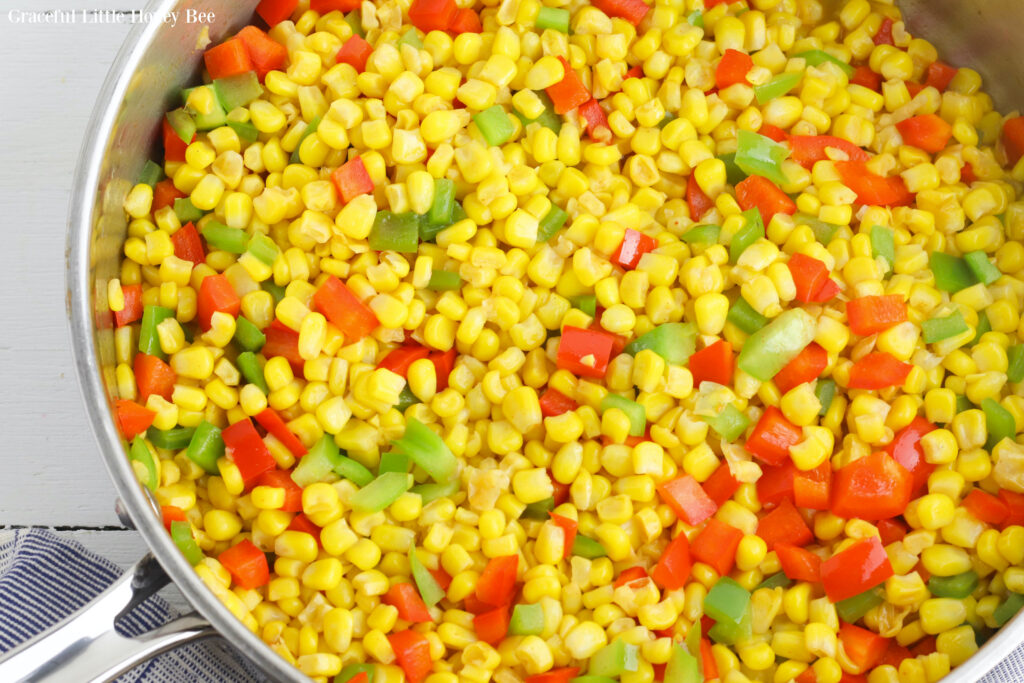 Fiesta corn in large round stainless steel skillet.