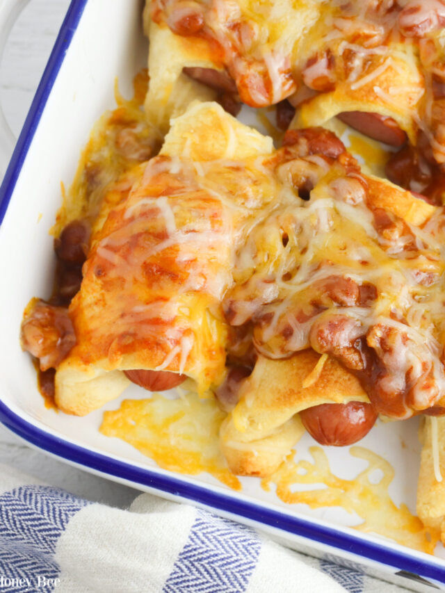 Chili Cheese Dog Casserole in a white enamelware casserole dish.