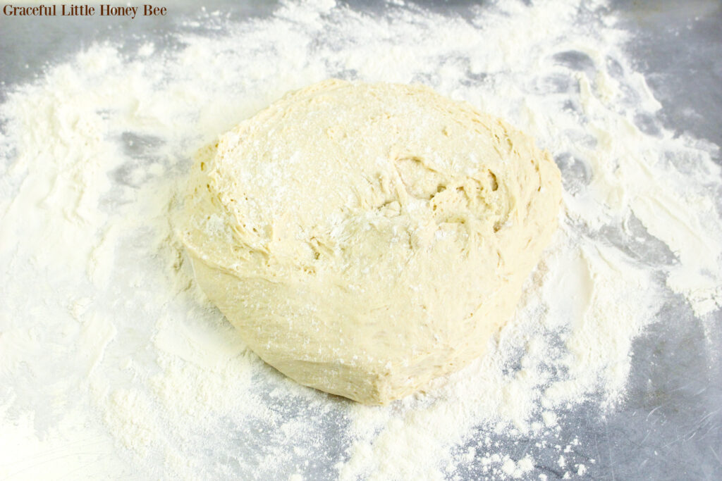 Bread dough on a lightly floured surface.