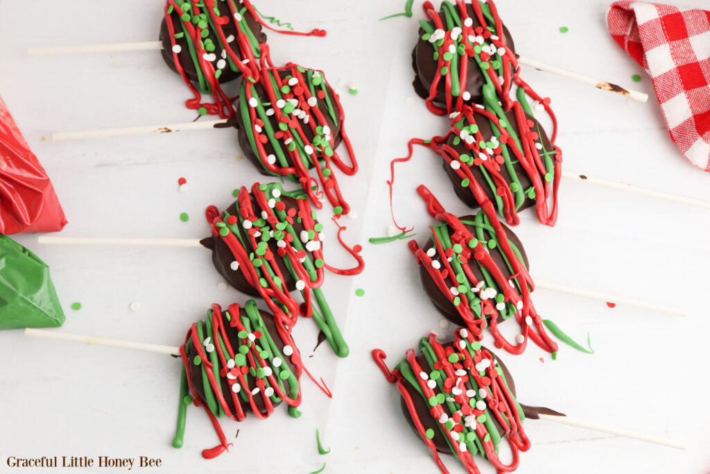 Ritz Pops on wax paper after they've been covered with sprinkles and icing.