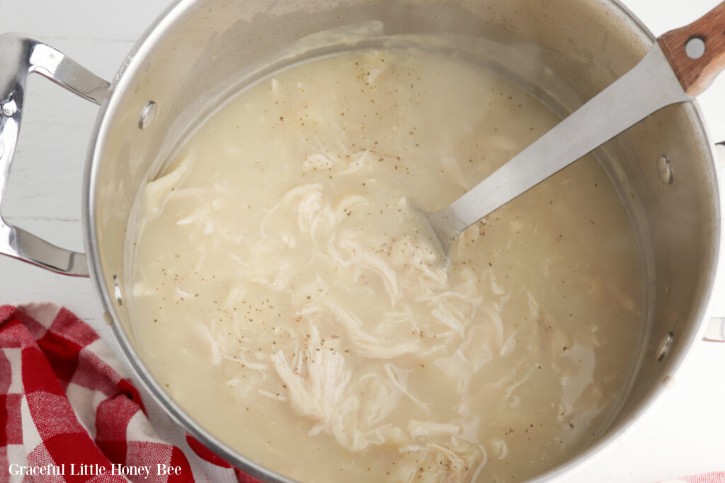 Chicken and broth in a large stockpot.