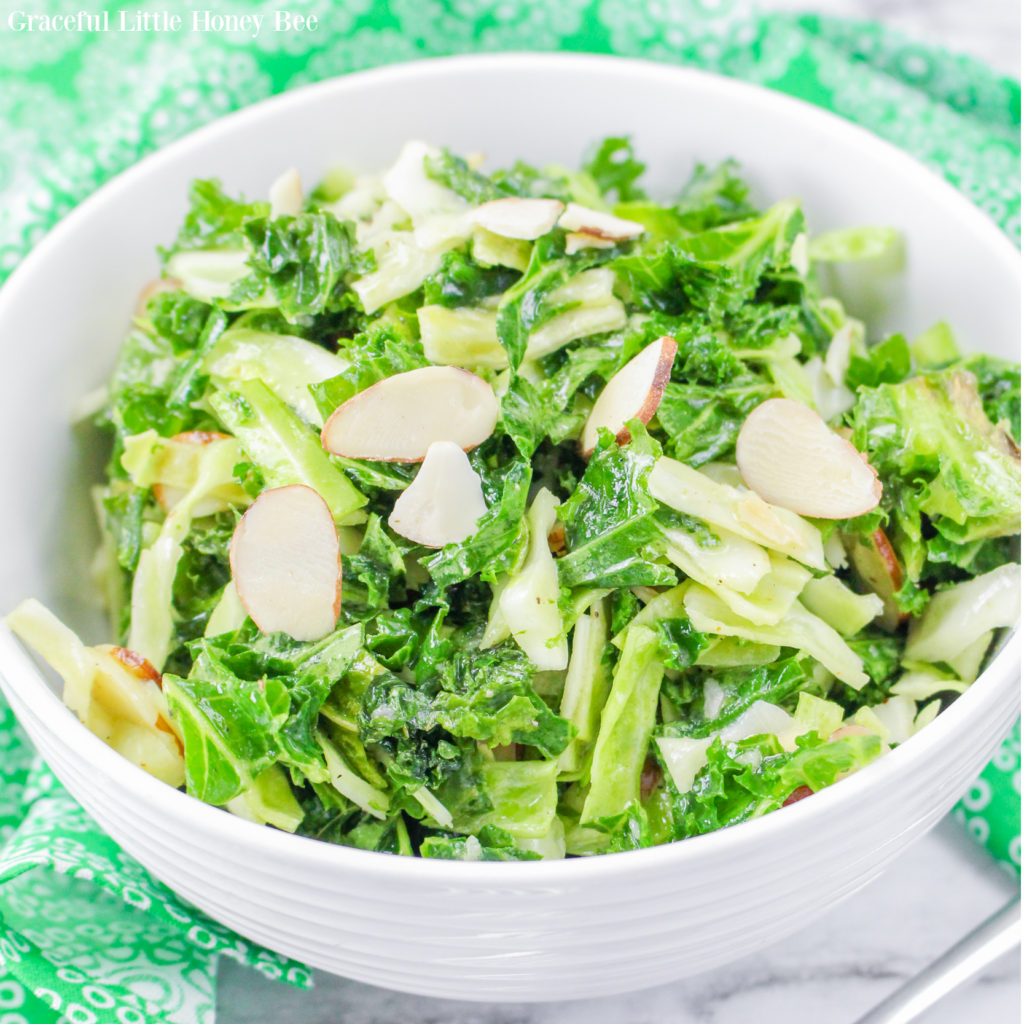 Close up of the Kale Crunch Salad in a round white bowl.