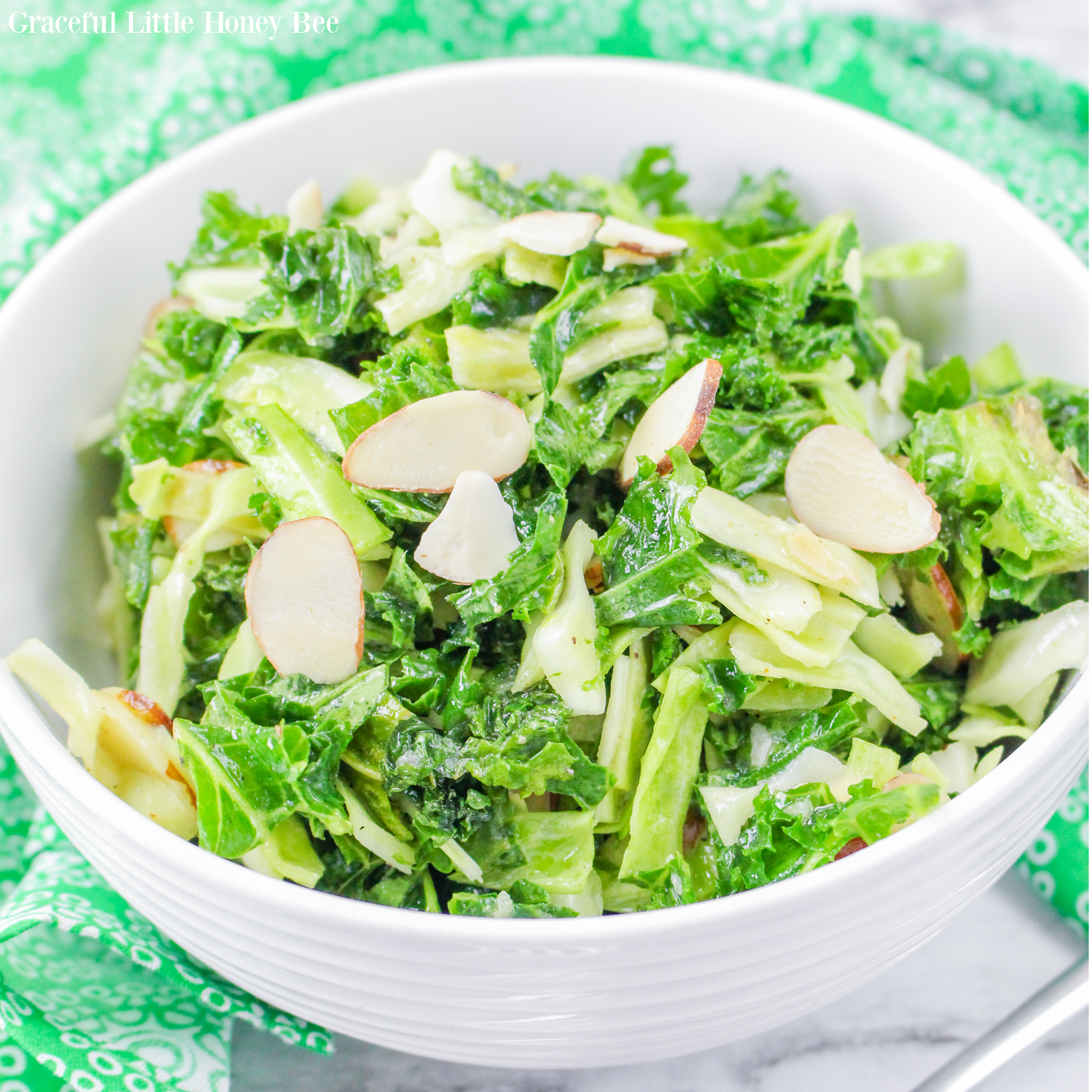 Close up of the Kale Crunch Salad in a round white bowl.