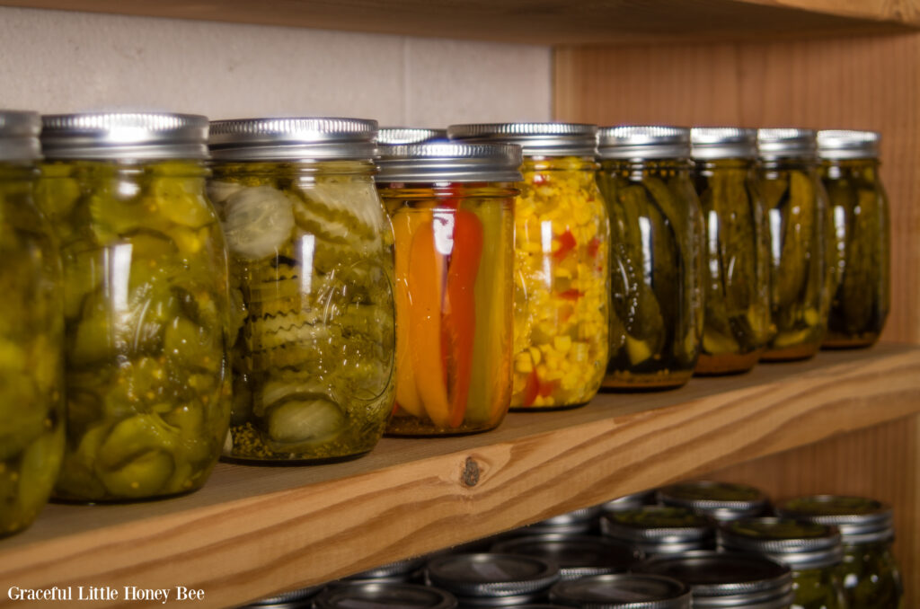 Wooden shelves lined with homecanned food.