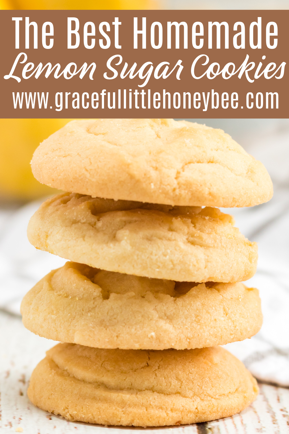 A close up of four lemon sugar cookies in a stack.