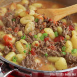 Close up of Ground Beef Gnocchi in a stainless steel skillet.