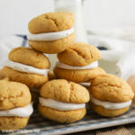 Whoopie Pies stacked on top of each other sitting on a tray.