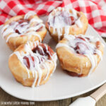 Close up of a Cherry Cheese Danish on a white plate.