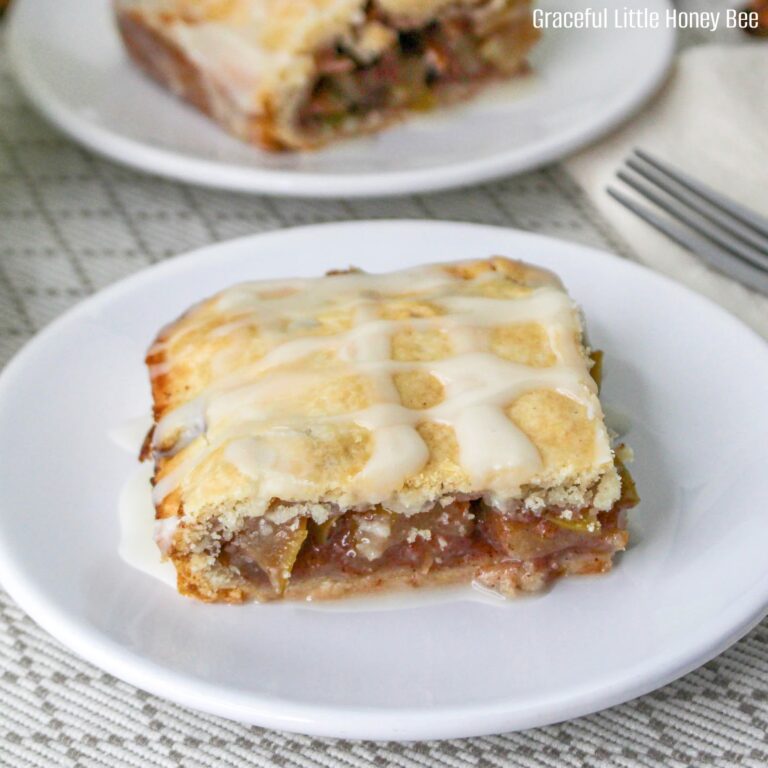 An apple pie bar sitting on a white plate.