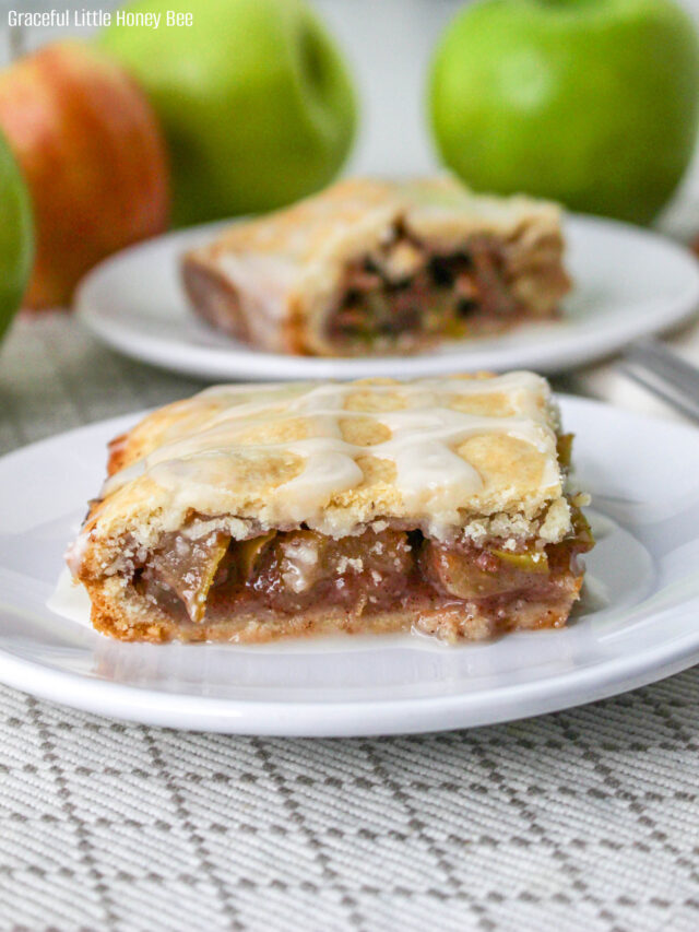 An apple pie bar sitting on a white plate.