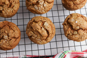 Pumpkin Gingerbread Muffins sitting on a cooling rack.