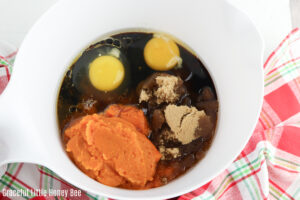 Wet ingredients in a white mixing bowl.