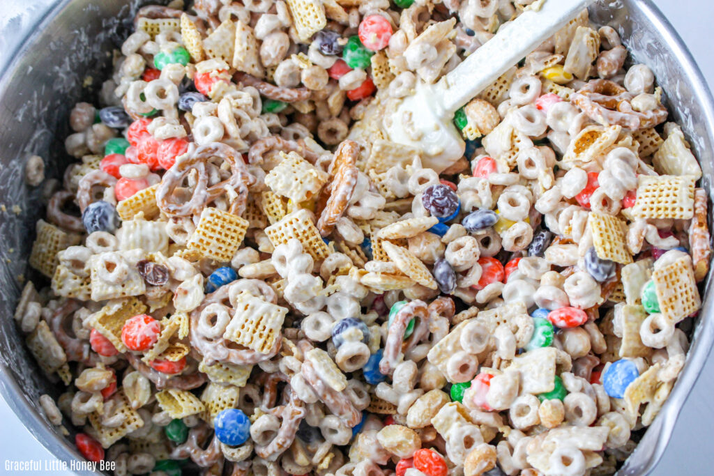 Party mix in a mixing bowl.